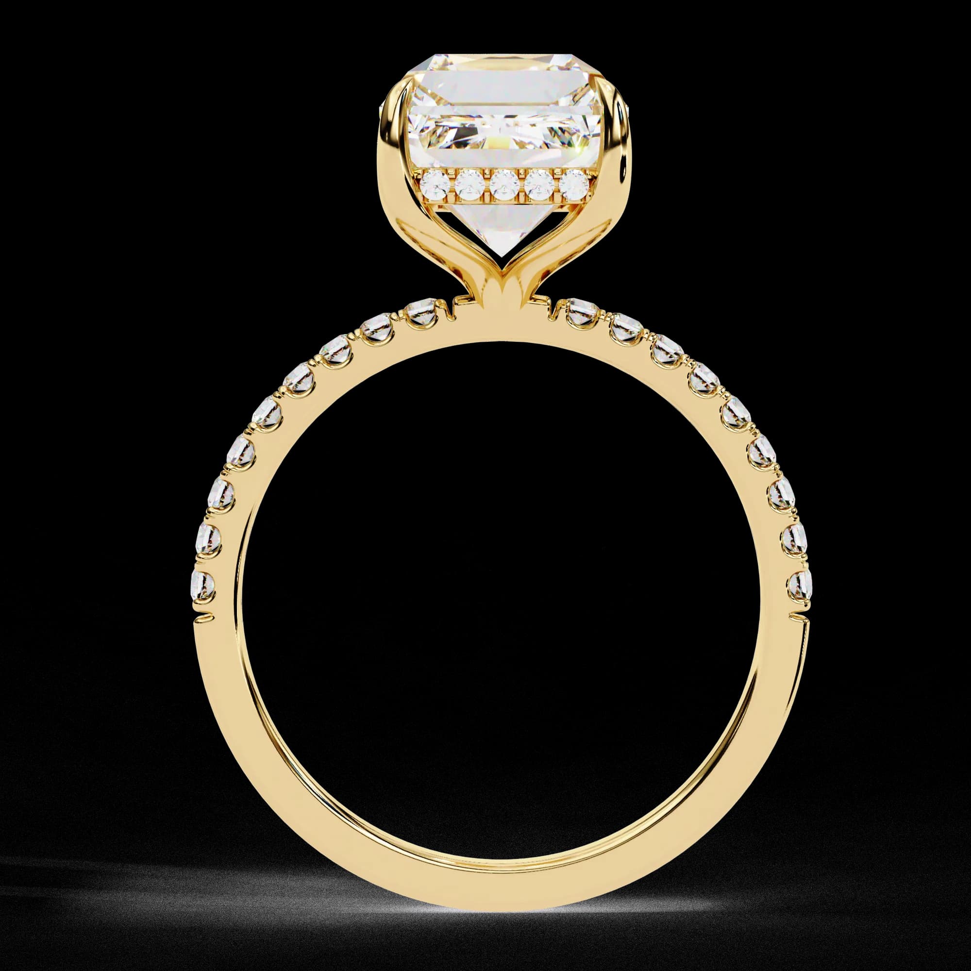 Through-finger view showing the hidden halo in yellow gold