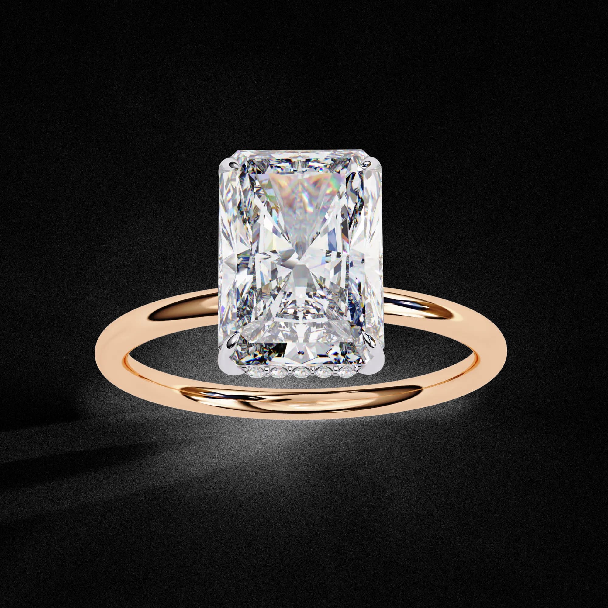 Radiant cut lab grown diamond hidden halo solitaire engagement ring in rose gold, angled view