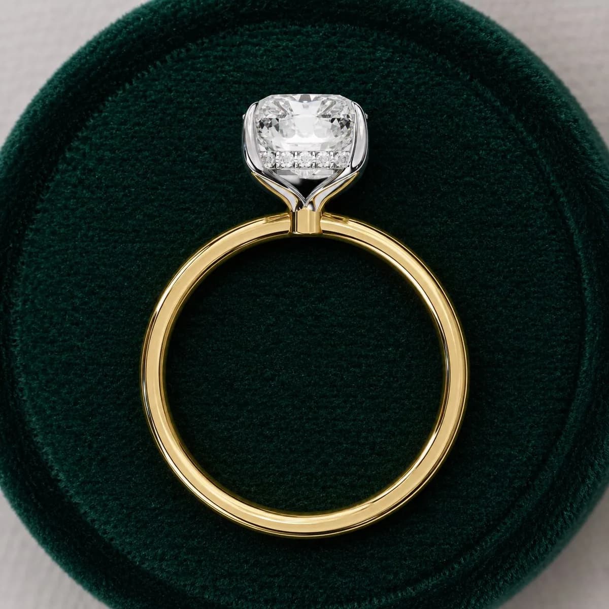 Radiant cut lab grown diamond hidden halo solitaire engagement ring in yellow gold in a green velvet ring box