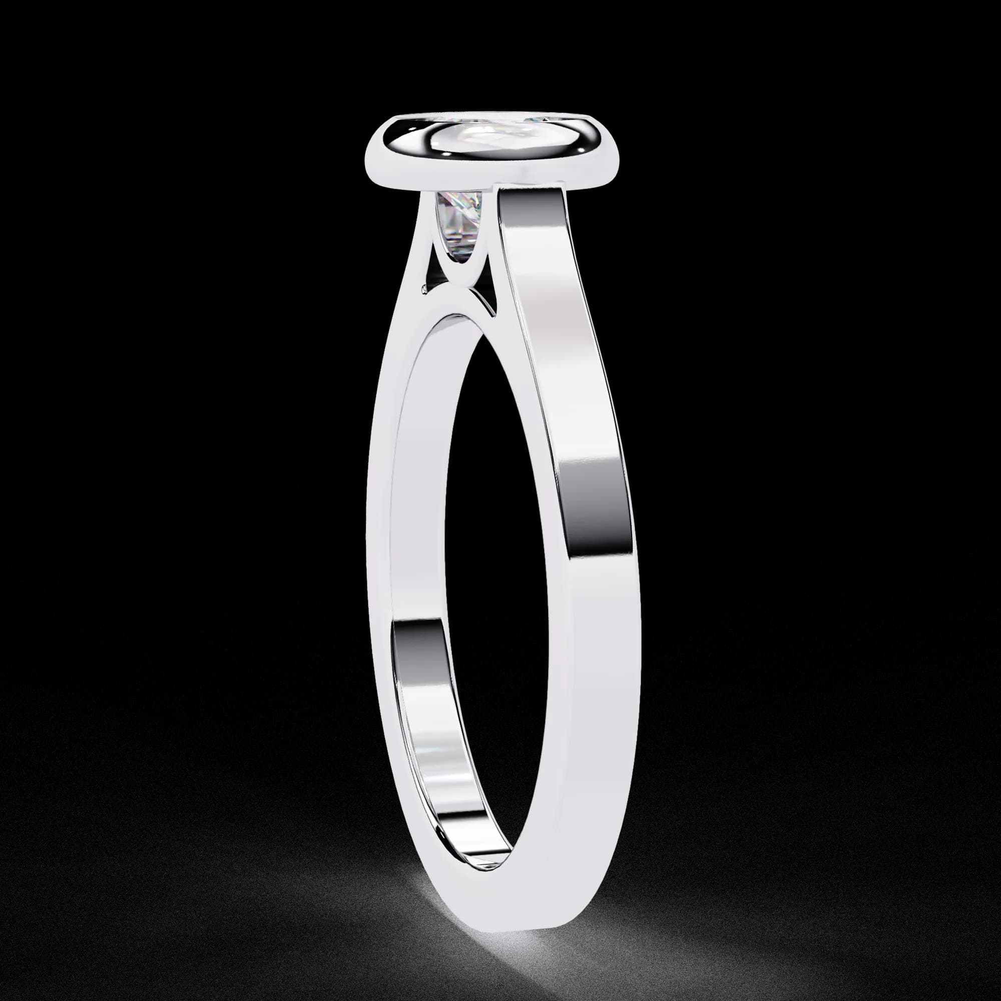 Round lab grown diamond bezel set solitaire engagement ring in white gold, side profile view