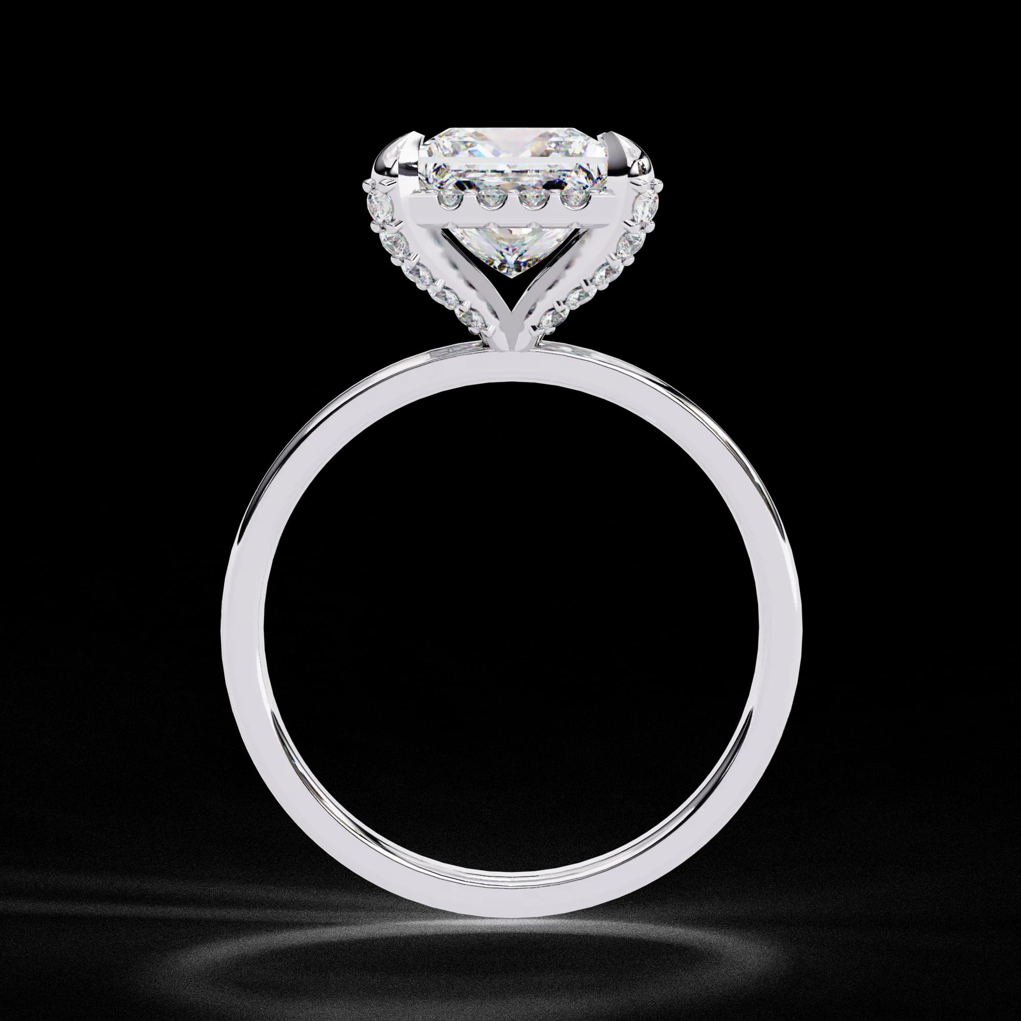 Princess cut lab grown diamond low halo engagement ring in white gold, through-finger view