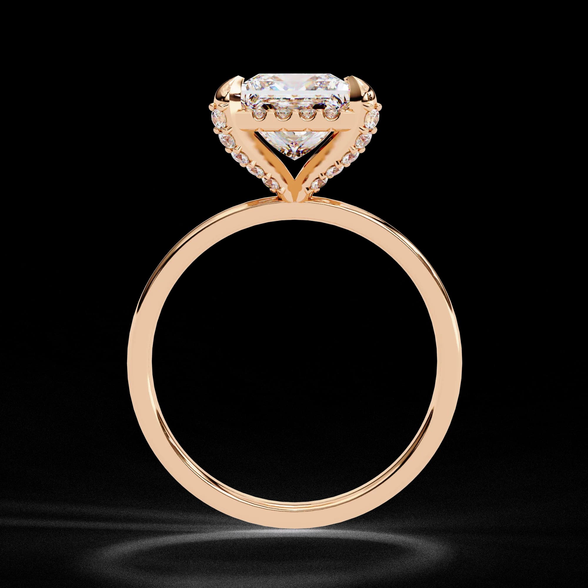Princess cut lab grown diamond low halo engagement ring in rose gold, through-finger view