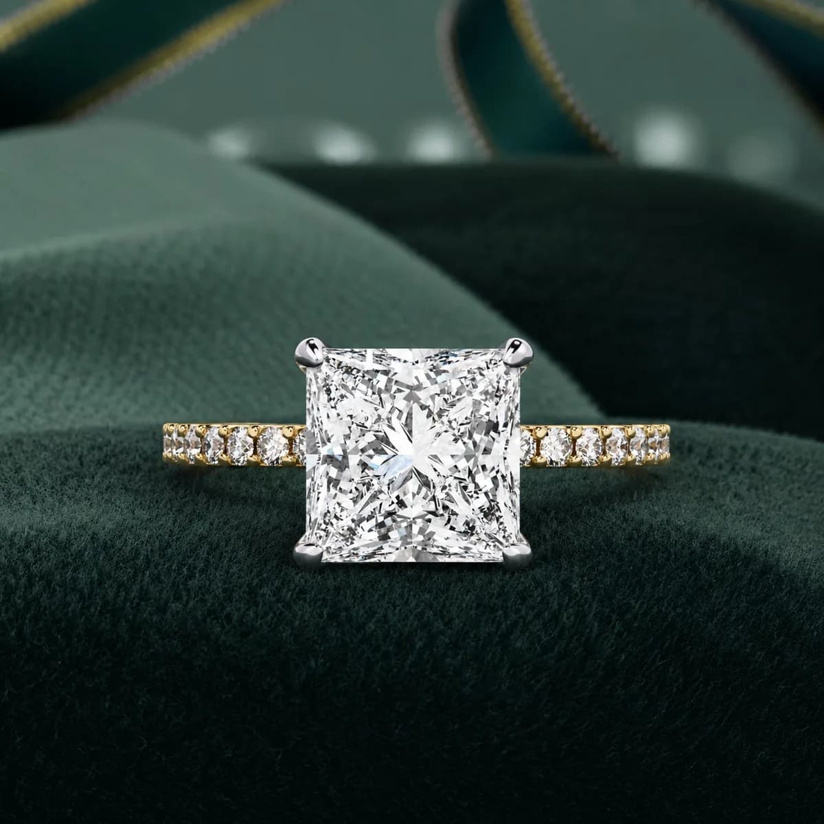 Princess cut lab grown diamond hidden halo pavé engagement ring in yellow gold on green velvet