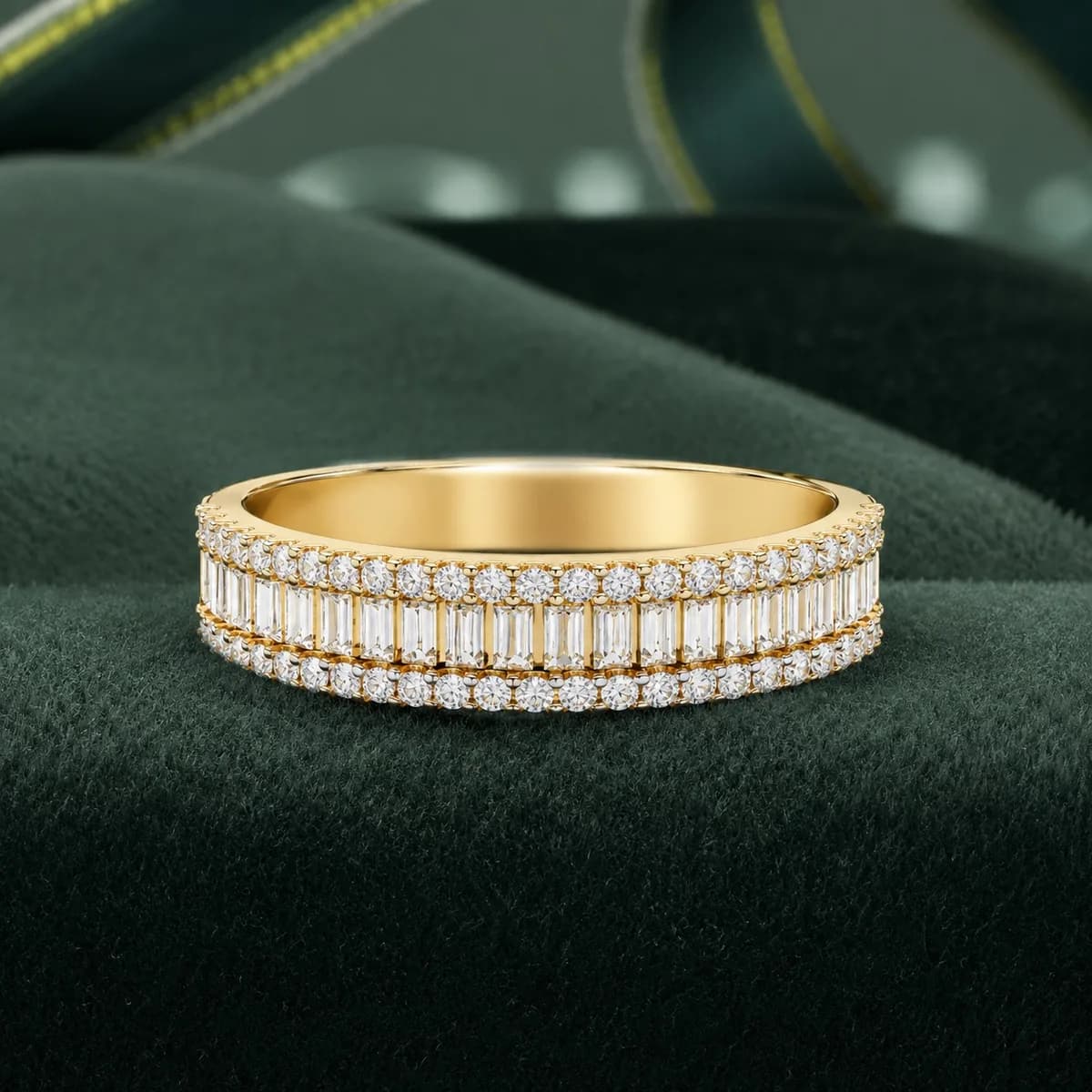 Baguette and round lab grown diamond three-row wedding band in yellow gold on green velvet