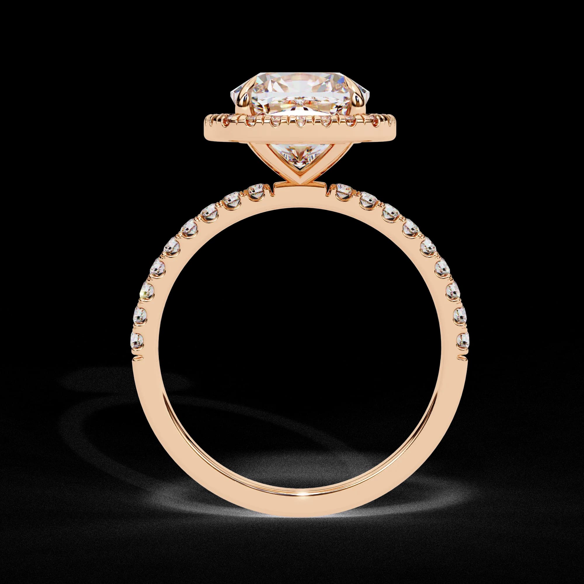Cushion cut lab grown diamond halo engagement ring in rose gold, through-finger view