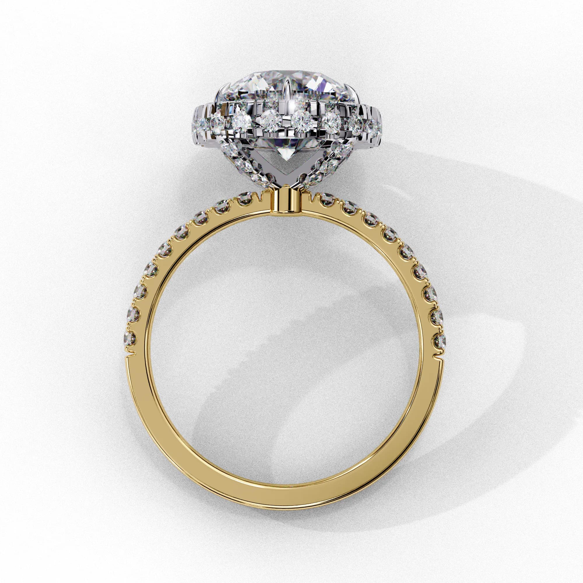 Round lab grown diamond halo engagement ring in yellow gold, through-finger view