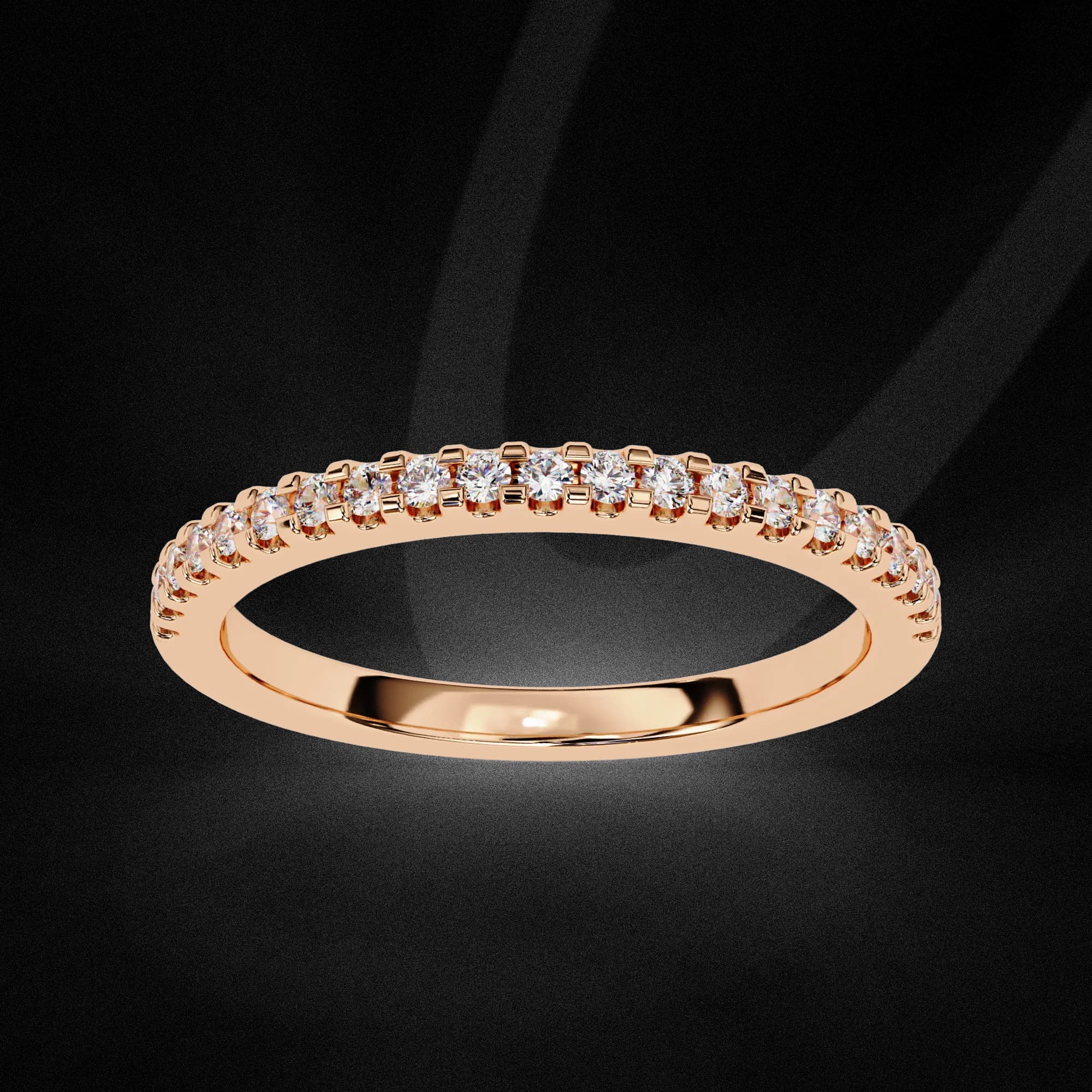 Round lab grown diamond pavé half eternity band in rose gold, angled view