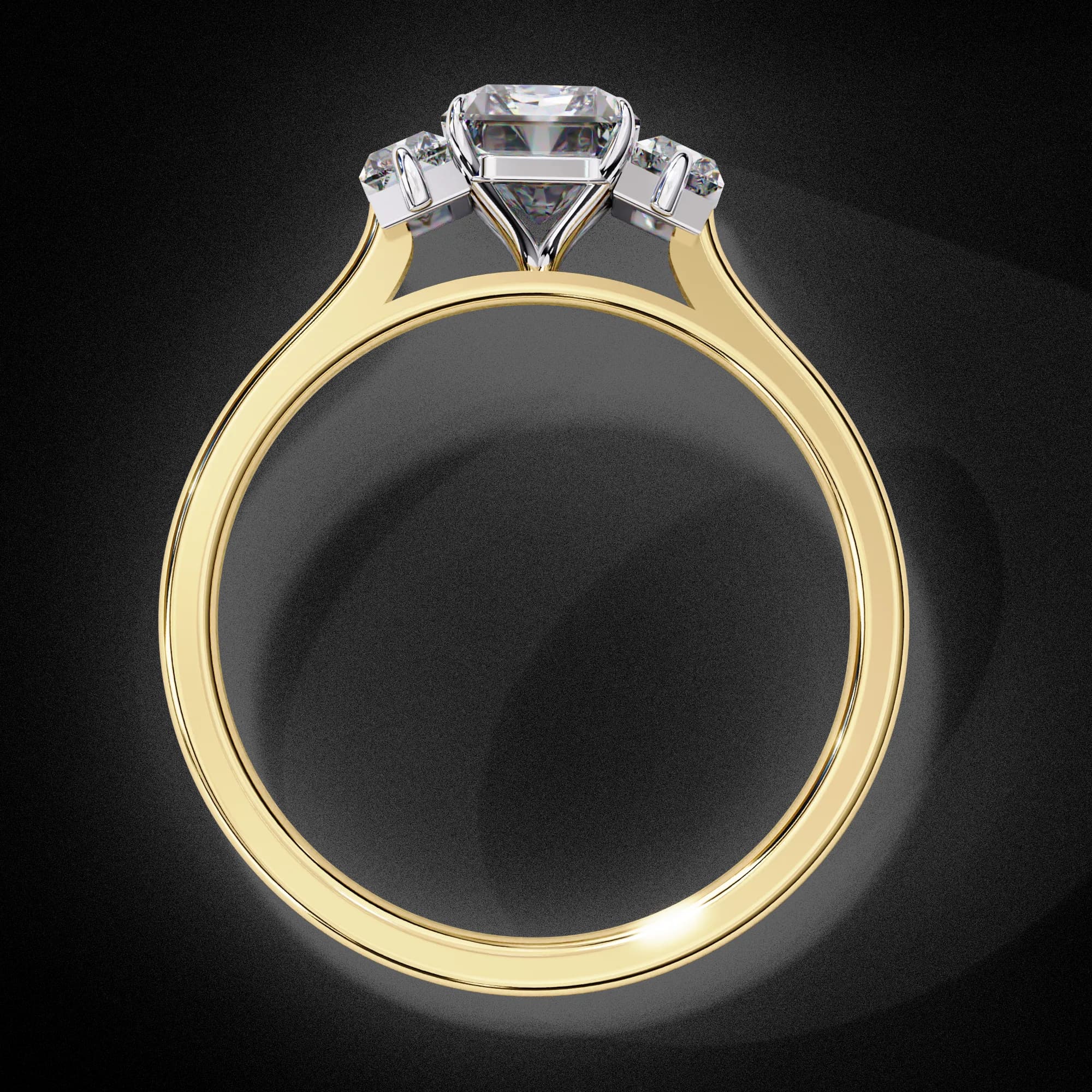 Emerald cut lab grown diamond three-stone engagement ring in yellow gold, through-finger view