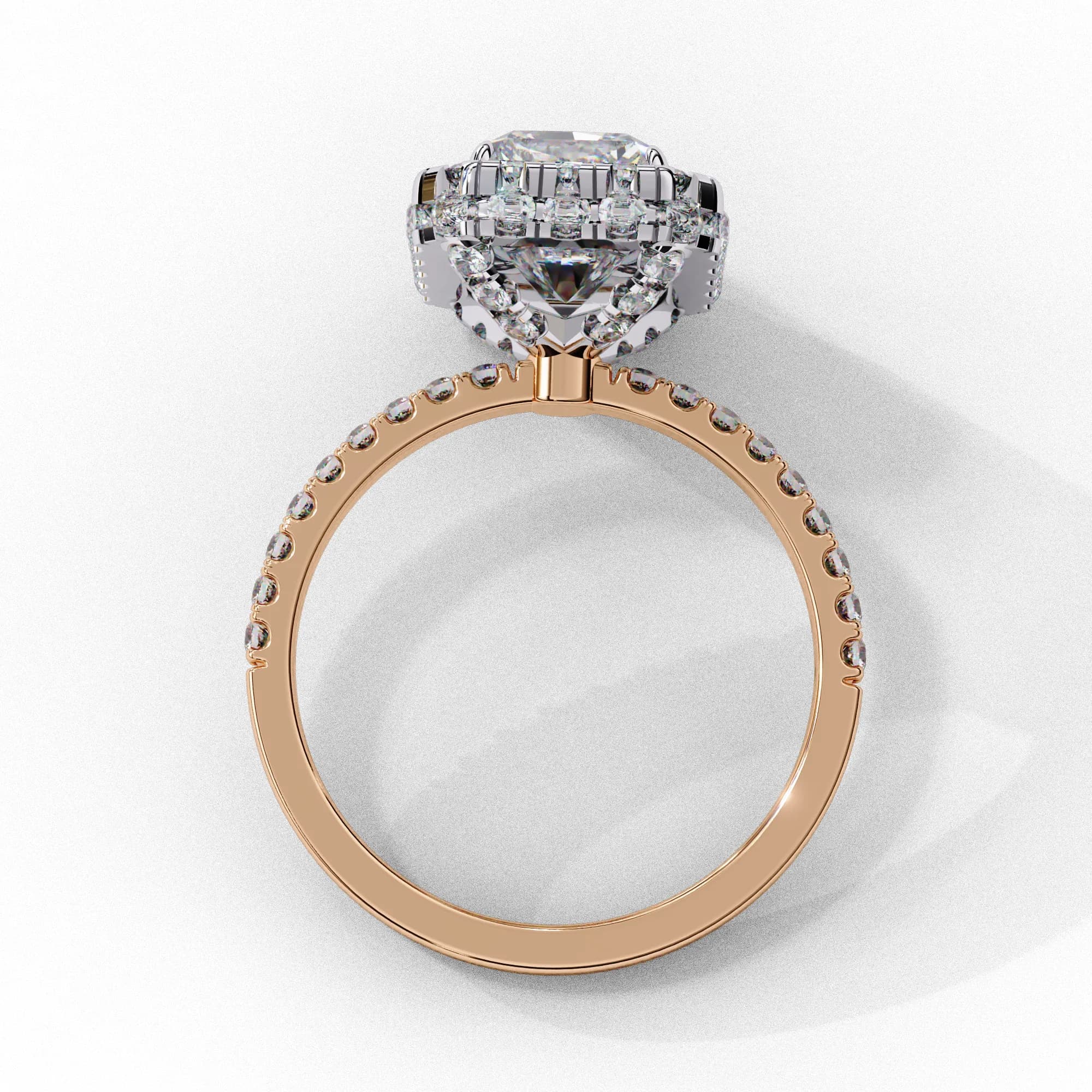 Radiant cut lab grown diamond halo engagement ring with pavé band in rose gold, through-finger view