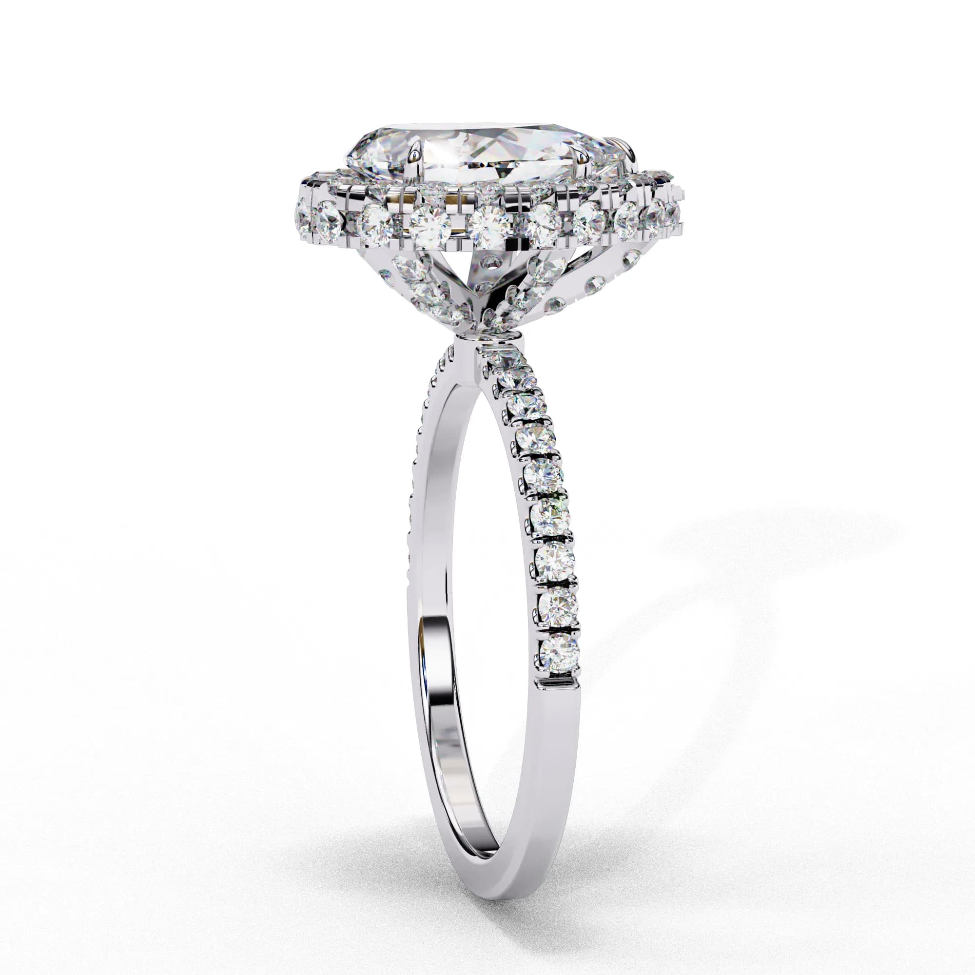 Pear cut lab grown diamond halo engagement ring with pavé band in white gold, side profile view