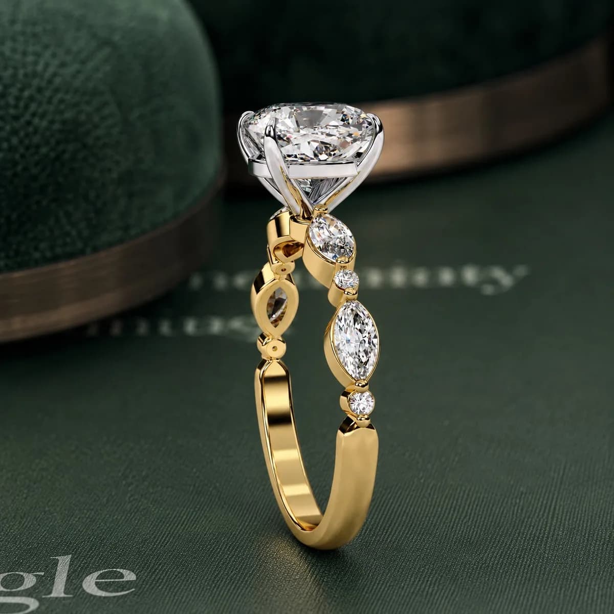 Cushion cut lab grown diamond engagement ring with marquise accents in yellow gold standing on a green velvet display