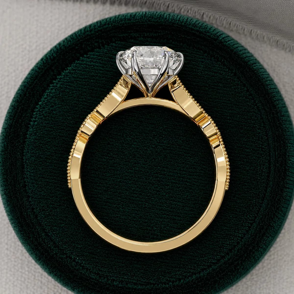 Round lab grown diamond vintage milgrain engagement ring in yellow gold standing in a green velvet ring box