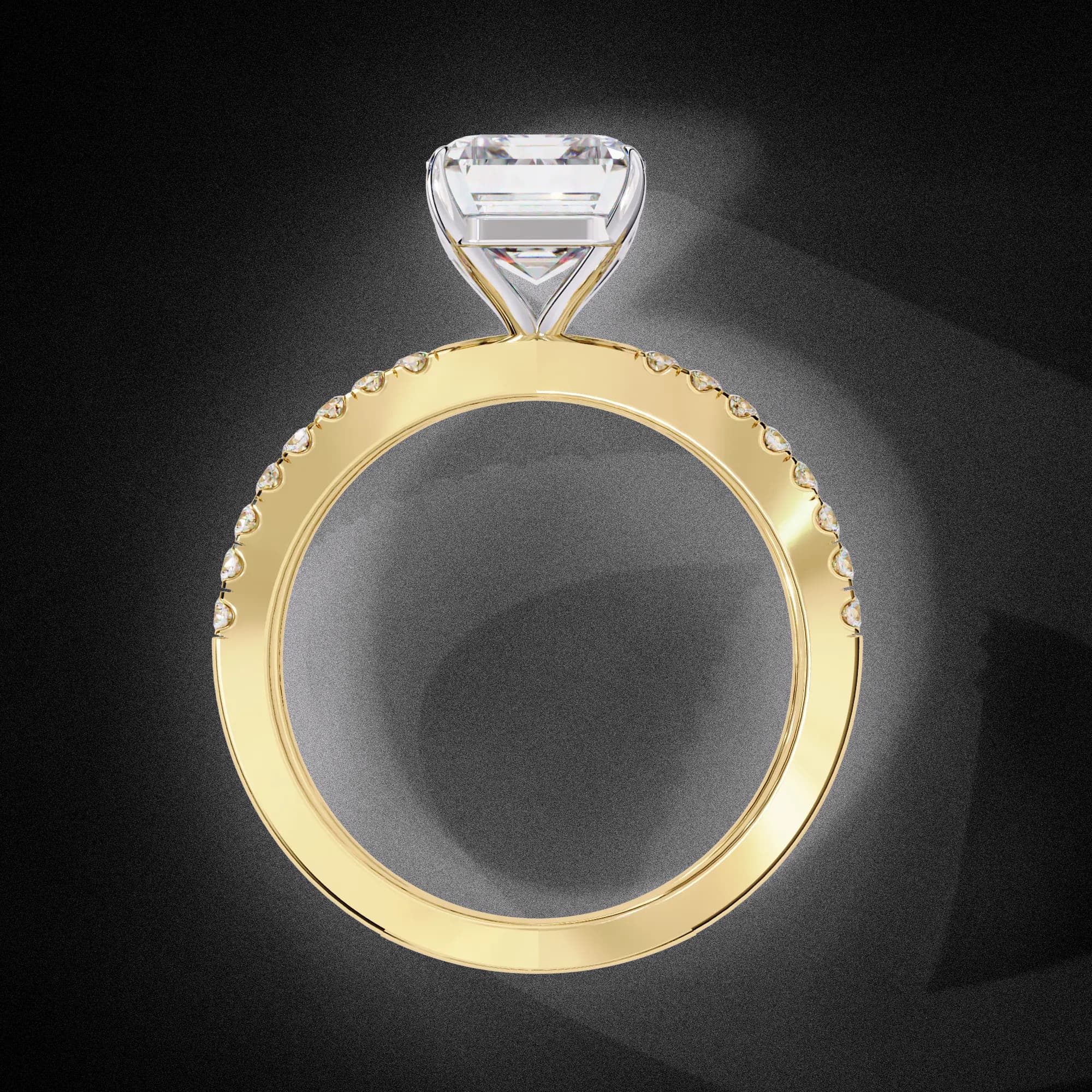 Emerald cut lab grown diamond criss-cross split shank engagement ring in yellow gold, through-finger view