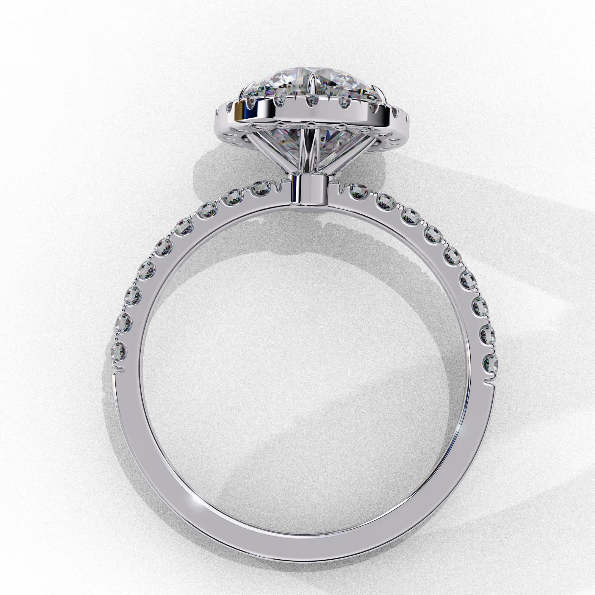 Round lab grown diamond halo engagement ring with pavé band in white gold, through-finger view