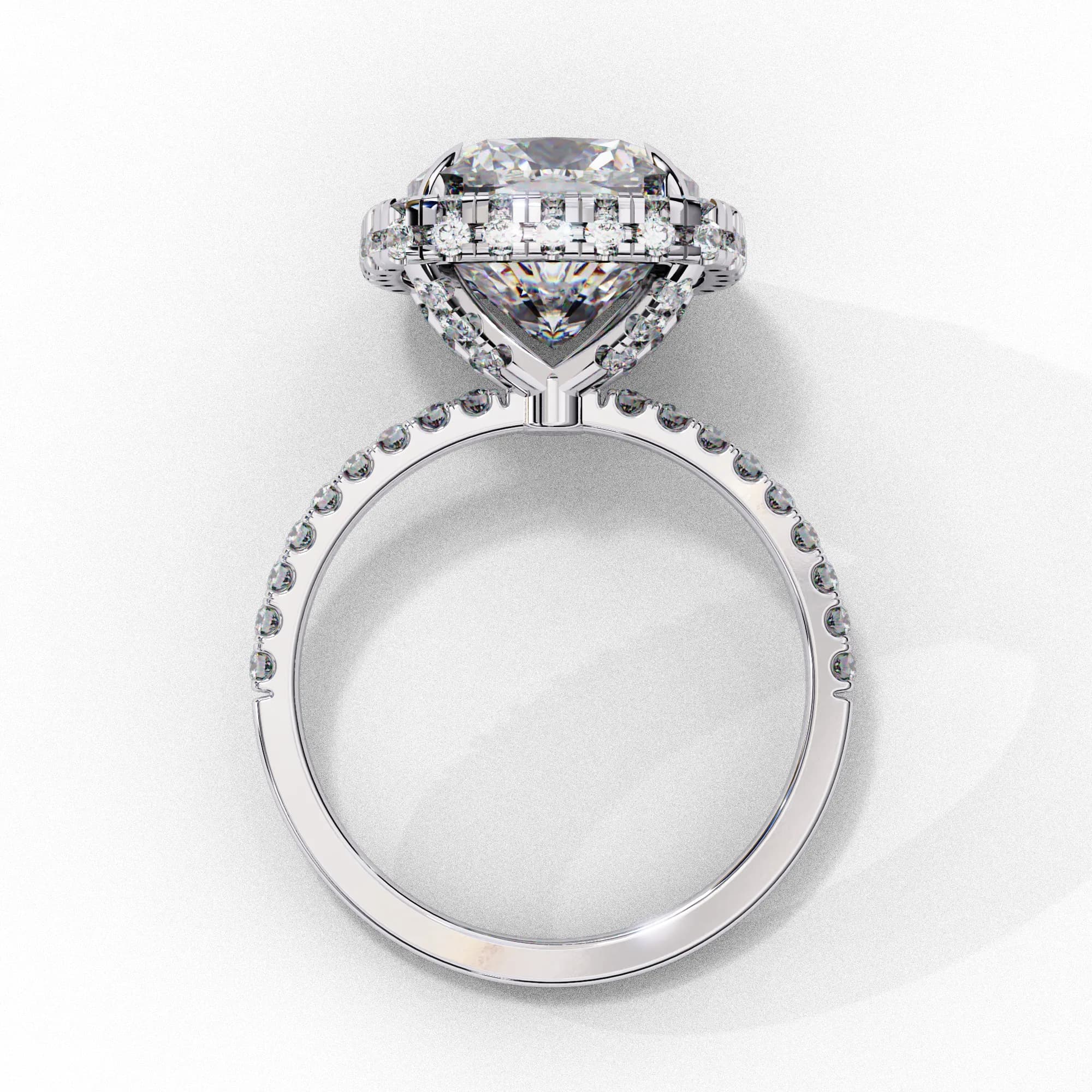 Cushion cut lab grown diamond halo pavé engagement ring in white gold, through-finger view