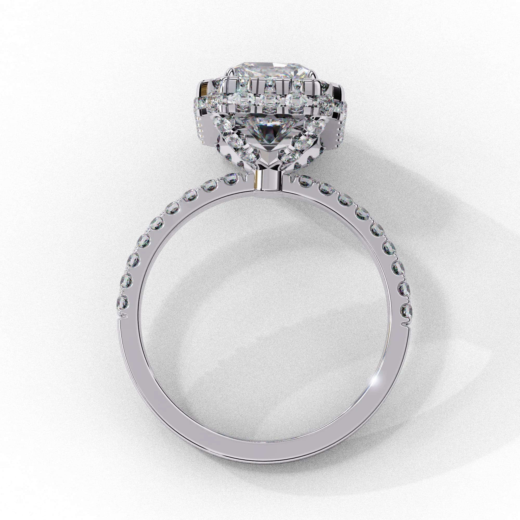 Emerald cut lab grown diamond halo engagement ring in white gold, through-finger view