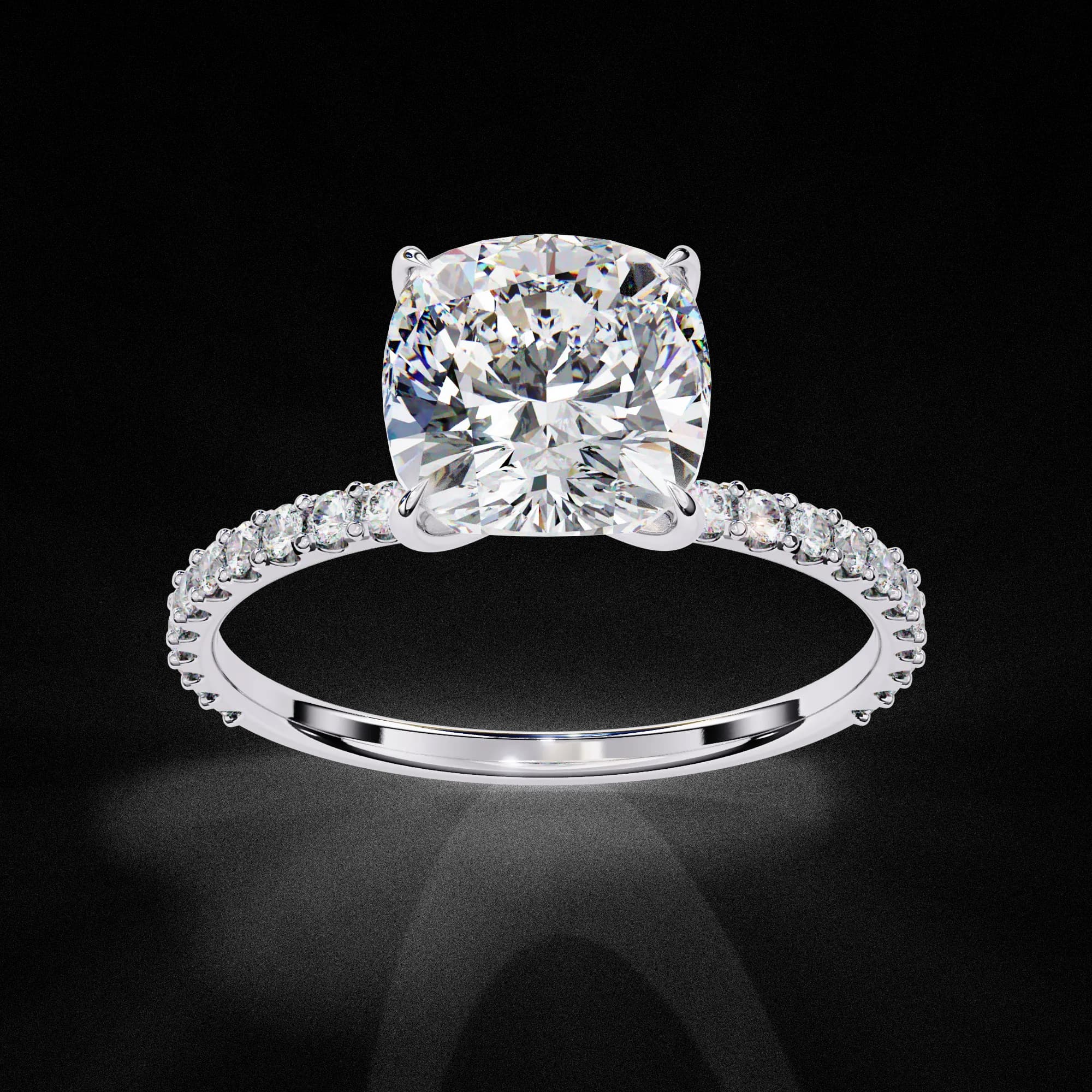 Cushion cut lab grown diamond hidden halo engagement ring with pavé band in white gold, angled view