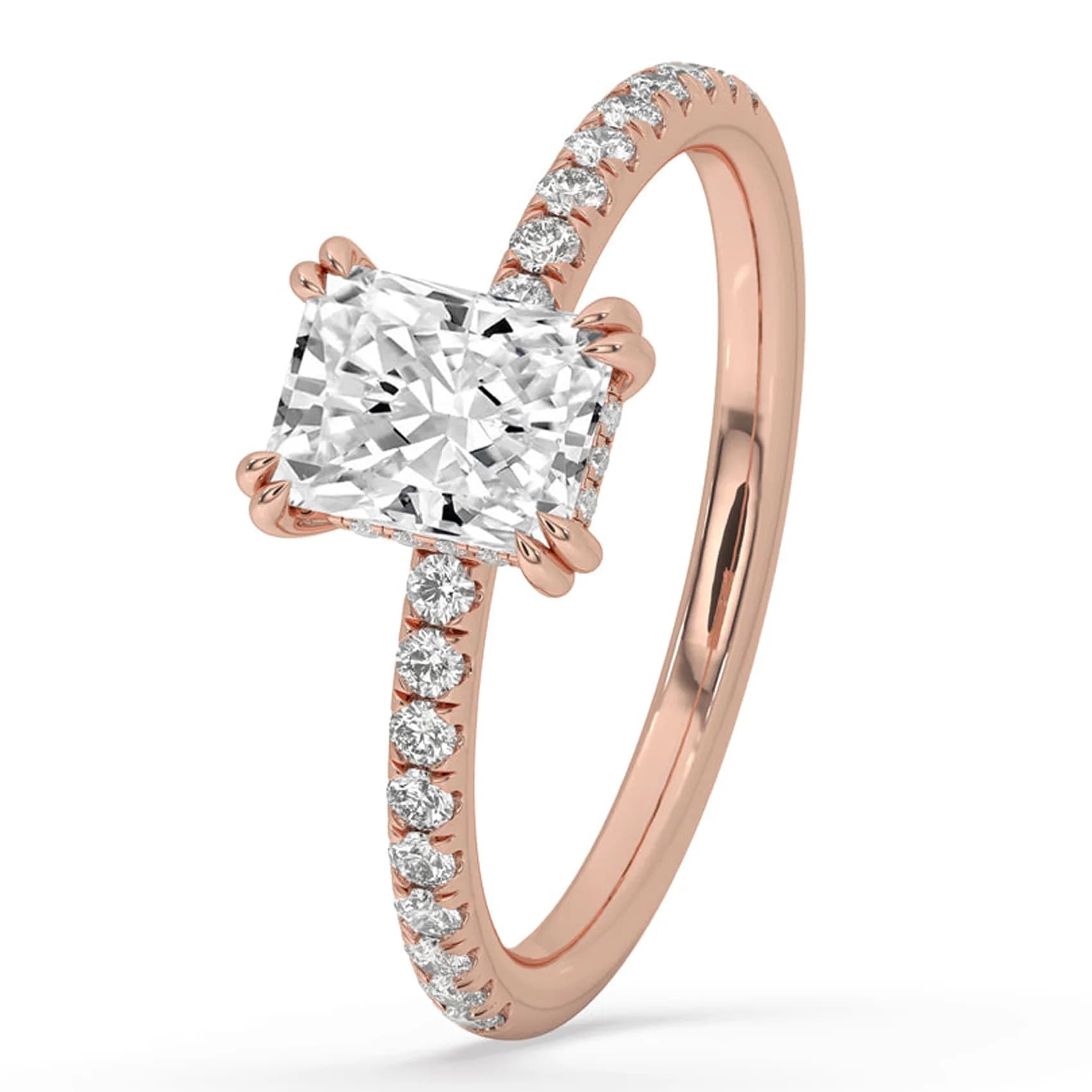 Angled view of the radiant cut hidden halo ring with pavé band in rose gold