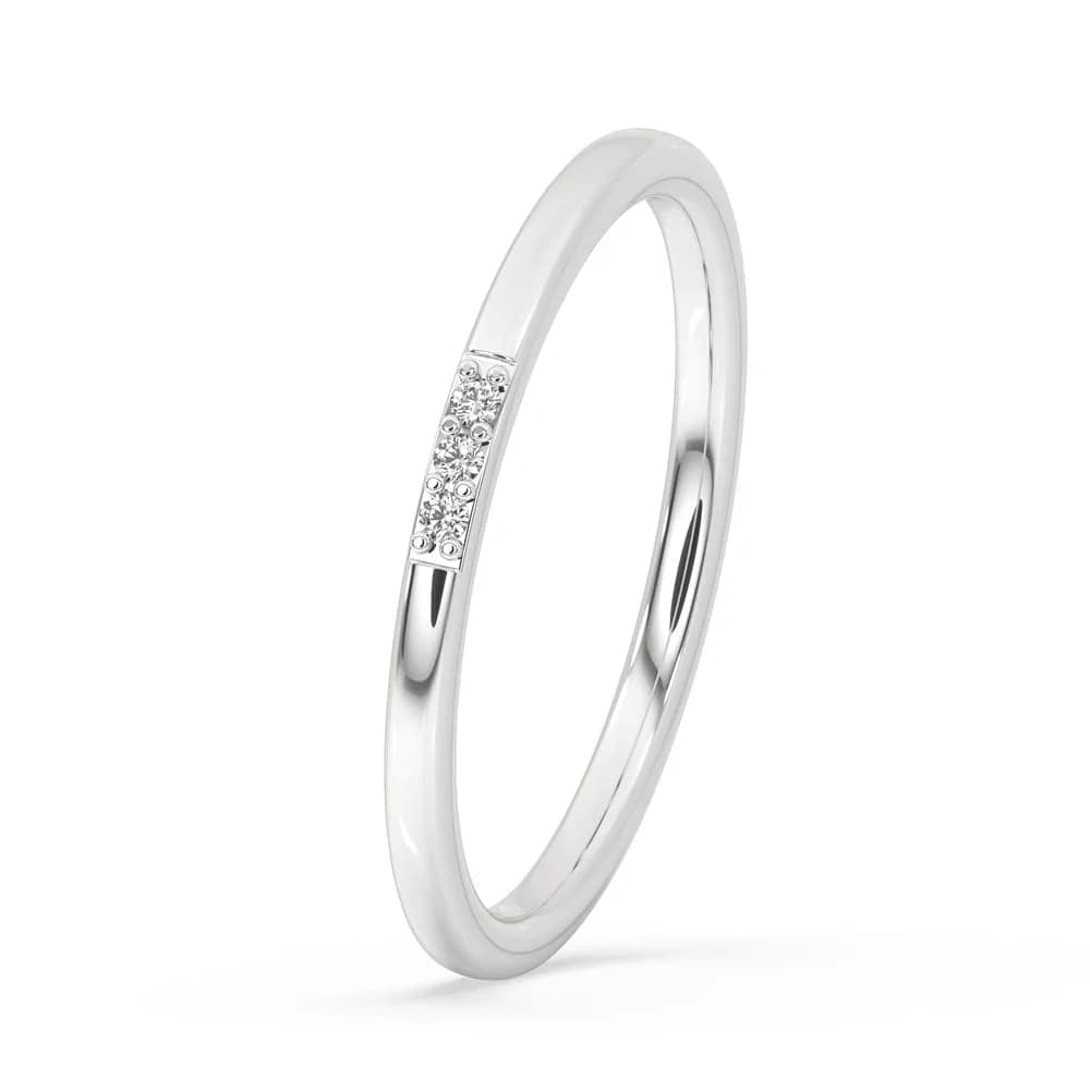 Angled view of the slim three stone diamond band in white gold